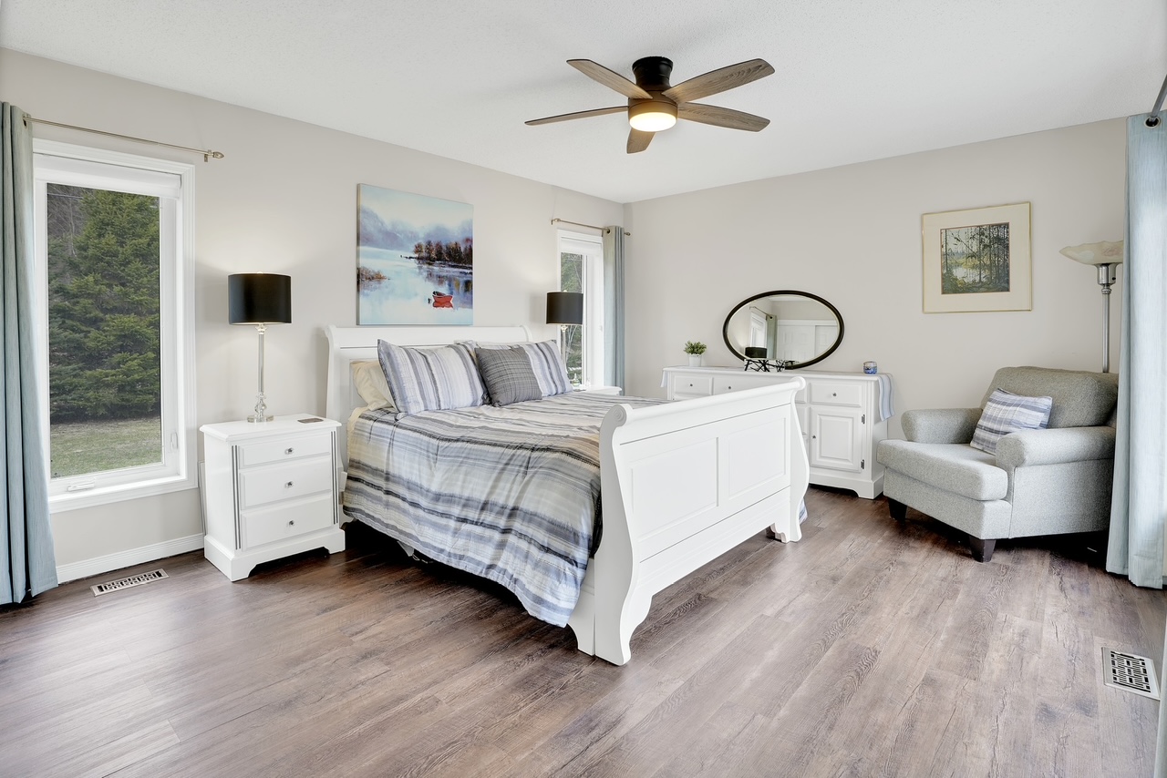 Bedroom with queen bed and window light