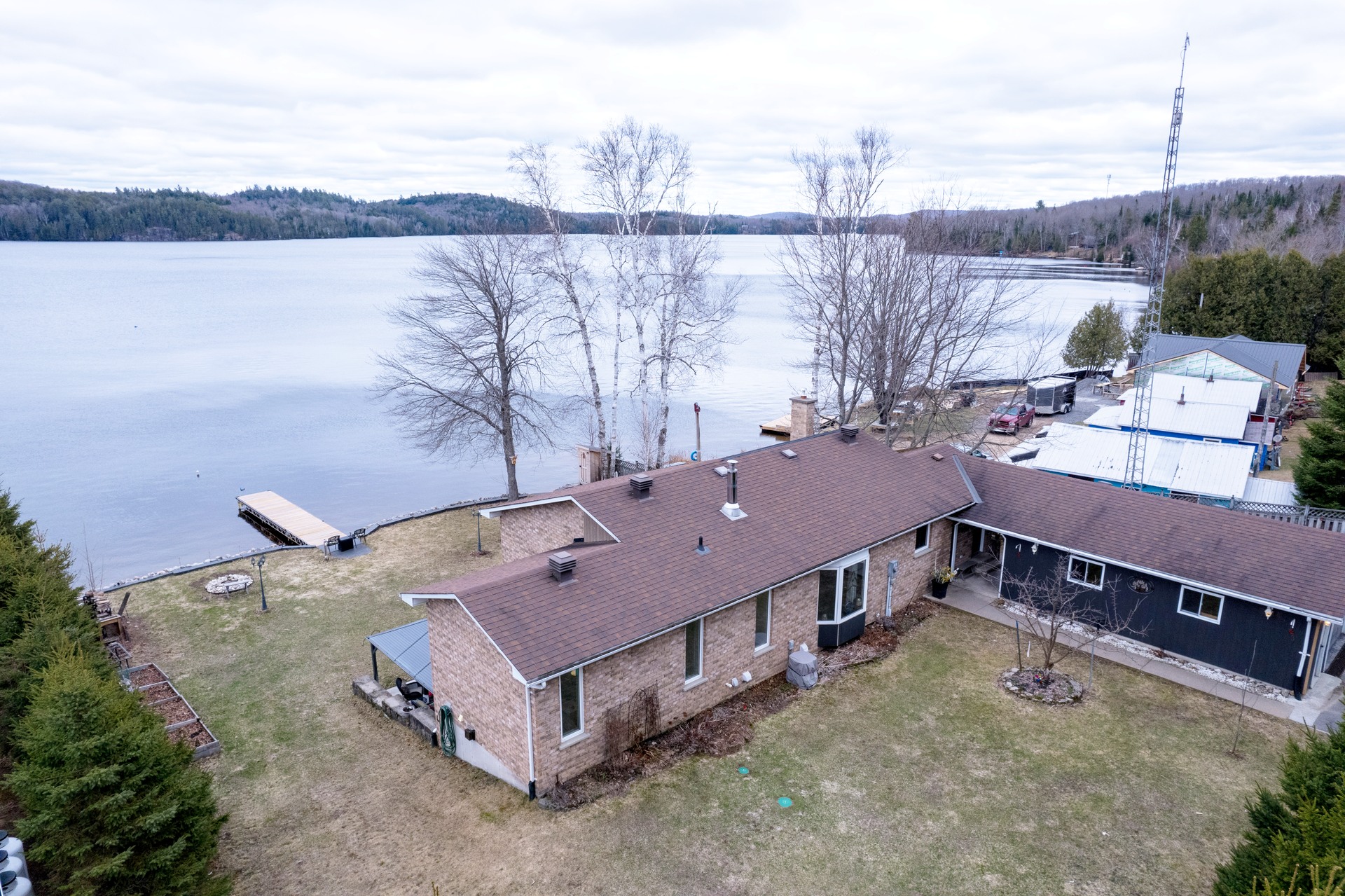 Aerial view of cottage and Baptiste Lake shoreline
